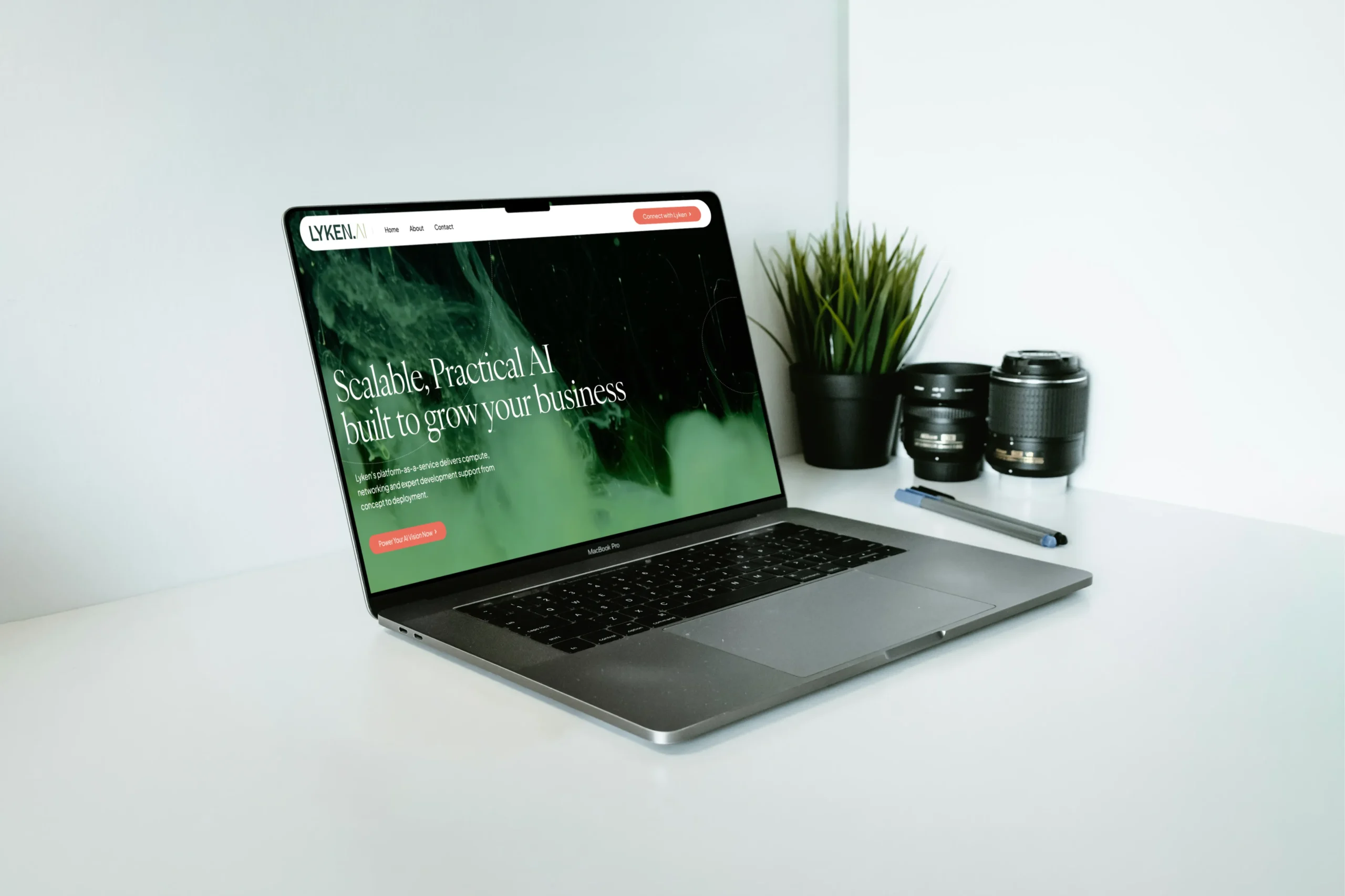 Lyken AI green website displayed on a laptop beside a houseplant