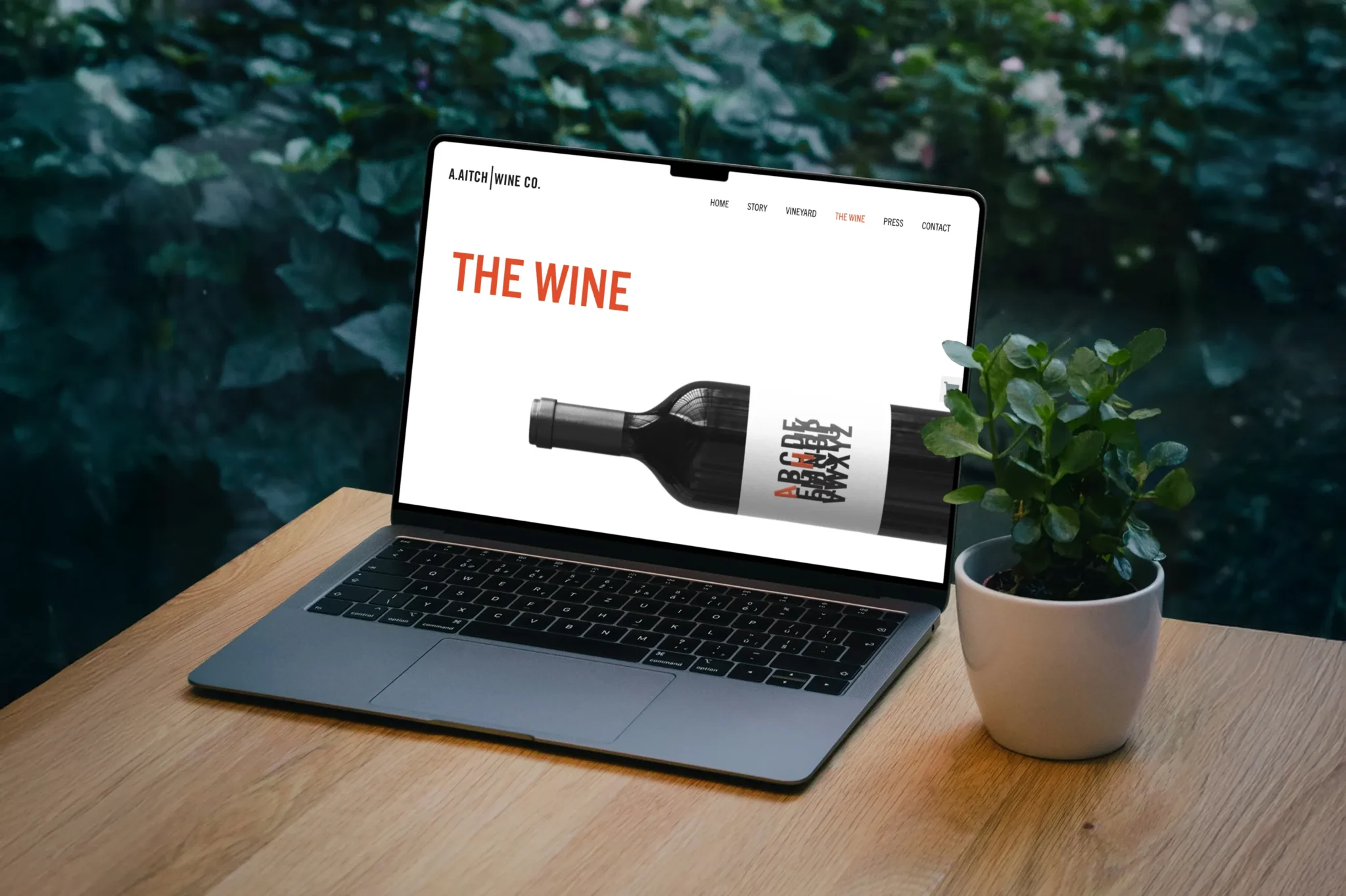 A.Aitch Wine website displayed on a laptop